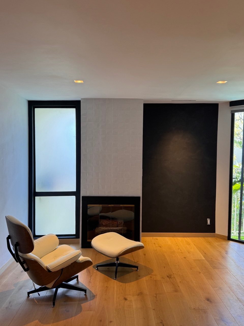 Blackened limewash fireplace wall
