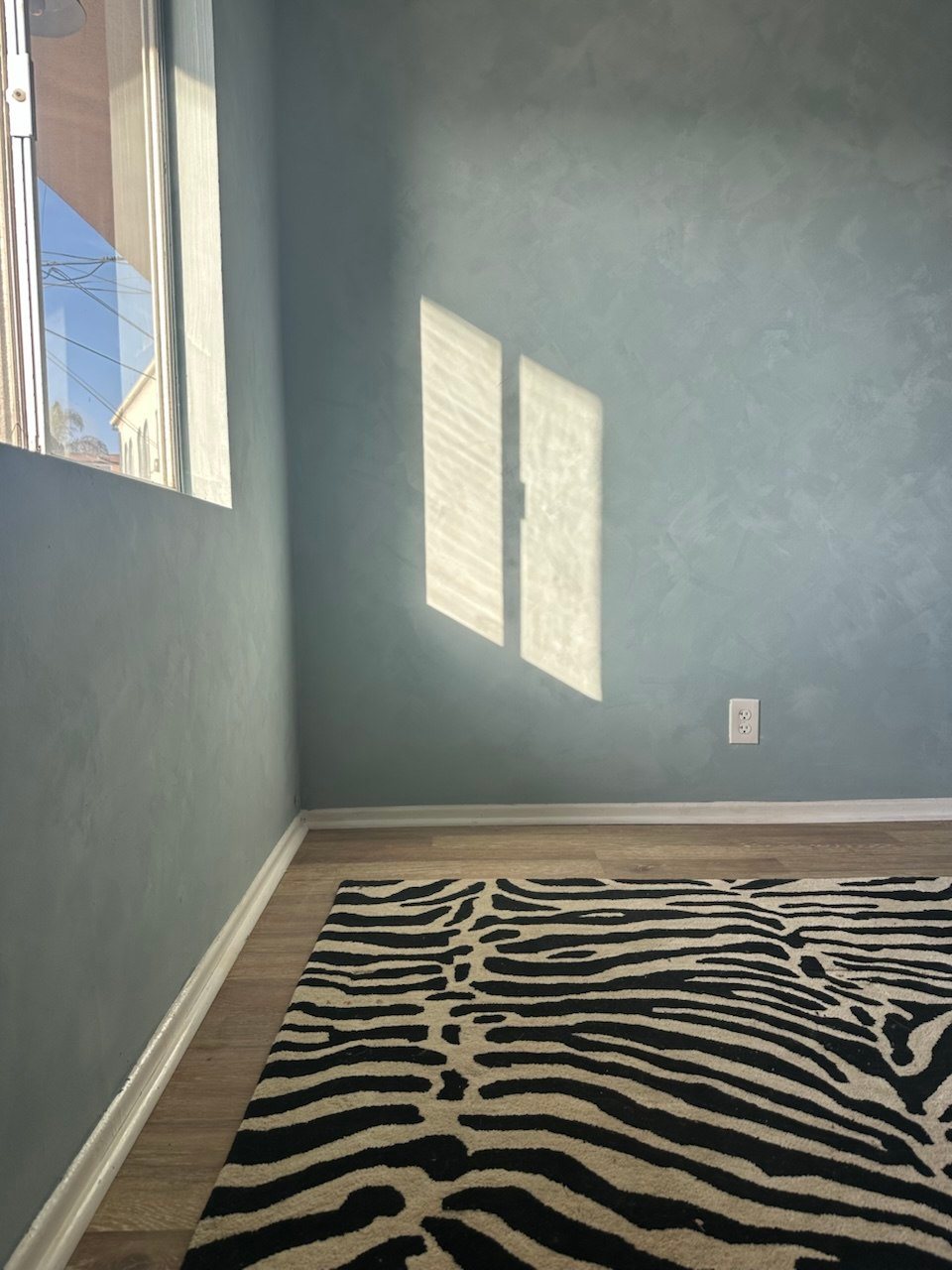 Blue-grey limewash bedroom