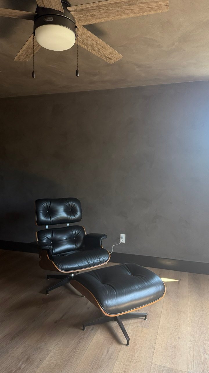 Charcoal limewash lounge wall