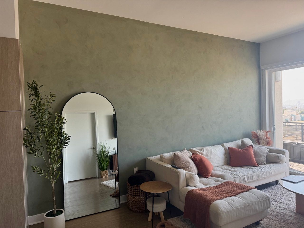 Sage limewash accent wall in Los Angeles